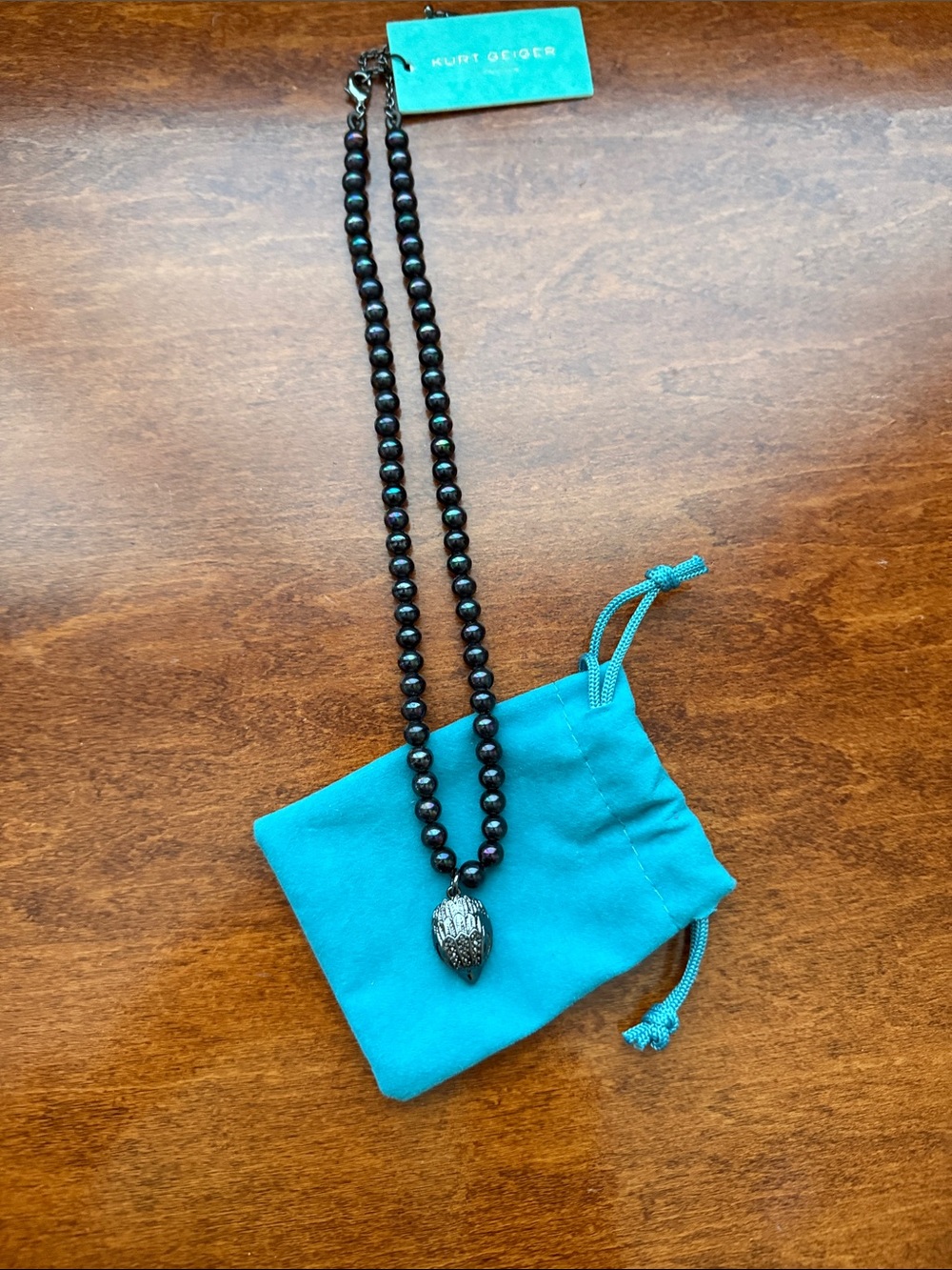 Kurt Geiger Black Beaded Necklace with Dark Metallic Pendant